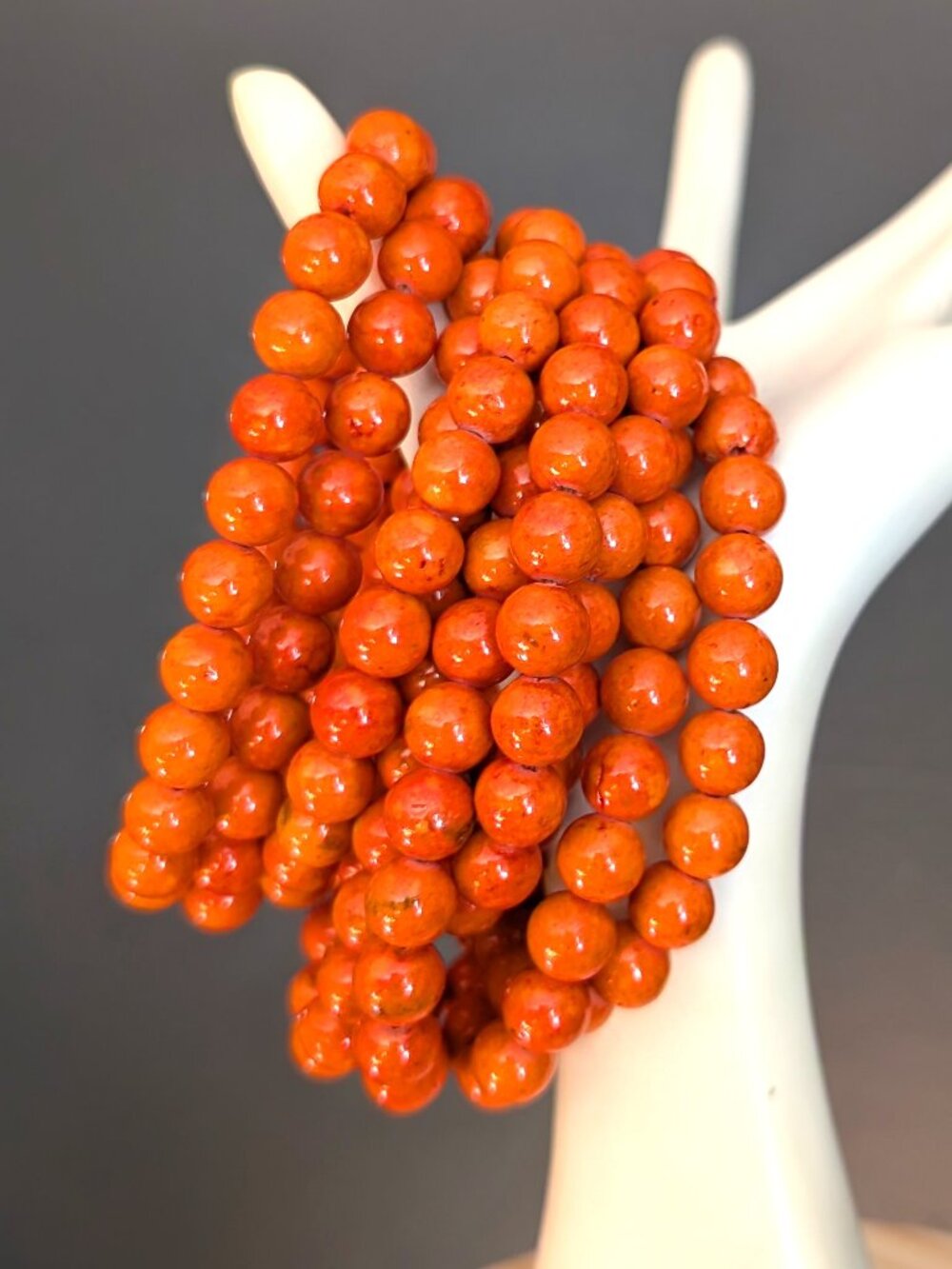 Bundle of 9 glossy orange ceramic beaded stretch bracelets